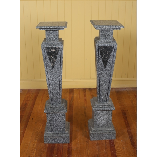 342 - A PAIR OF GREY VEINED MARBLE PEDESTALS each with a square moulded top above a tapering column on squ... 