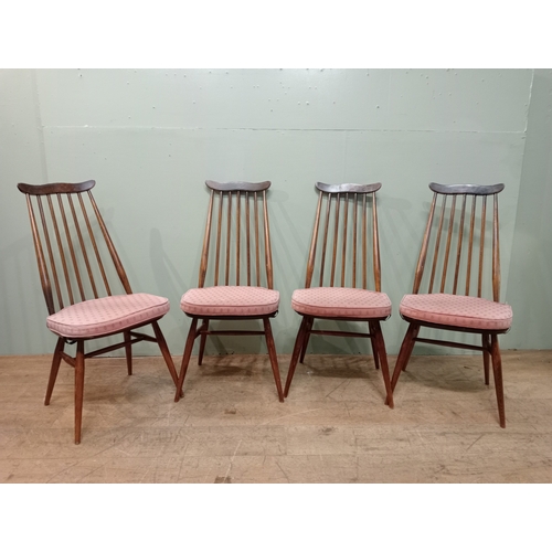 349 - A SET OF FOUR ERCOL GOLDSMITH DINING CHAIRS each with a shaped top rail and spindle splat with panel... 