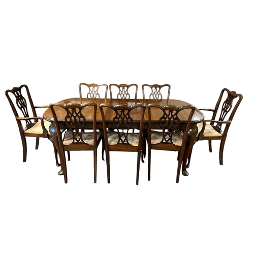 364 - A NINE PIECE MAHOGANY DINING ROOM SUITE comprising eight Chippendale style dining chairs, including ... 