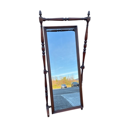 385 - A MAHOGANY CHEVAL MIRROR the rectangular plate within a moulded frame raised on a baluster stand wit... 