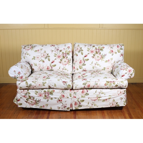 39 - A VICTORIAN STYLE SETTEE with scroll over arms and loose cushions on square tapering legs 211cm (w)