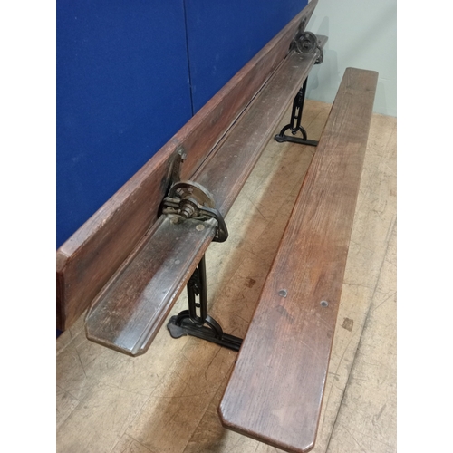 396 - A LATE 19TH CENTURY CAST IRON AND PINE BENCH the rectangular sloped top with panelled seat raised on... 