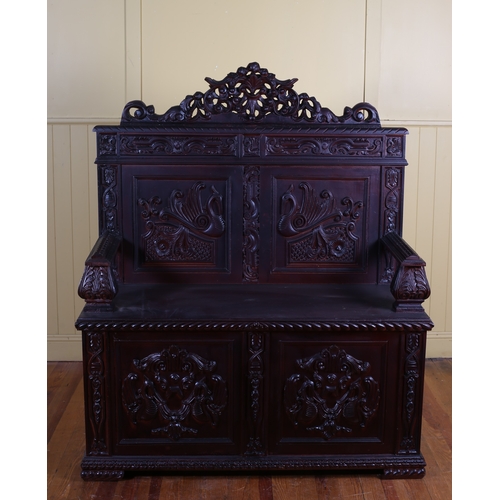 401 - A RENAISSANCE REVIVAL HARDWOOD BENCH with pierced C-scroll cresting above a pair of carved panels an... 