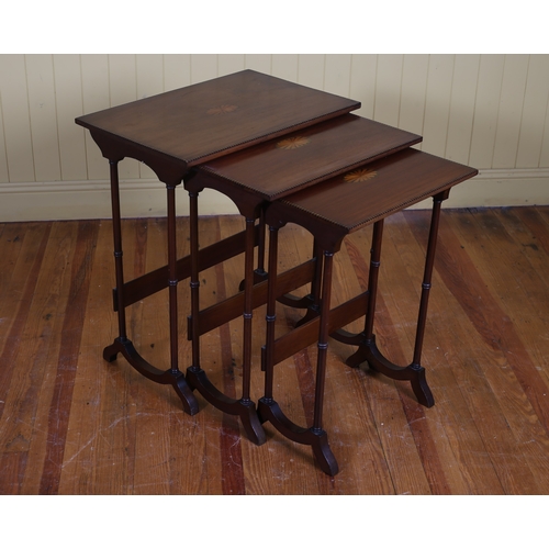 41 - AN EDWARDIAN MAHOGANY AND SATINWOOD INLAID NEST OF THREE TABLES of rectangular outline the shaped to... 