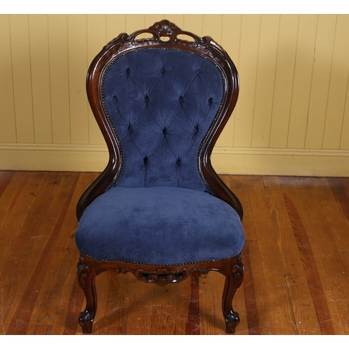 44 - A VICTORIAN STYLE MAHOGANY AND UPHOLSTERED SIDE CHAIR the pierced carved top rail above a buttoned u... 