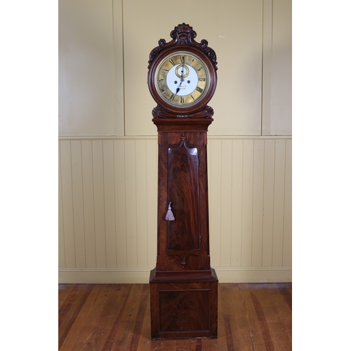 45 - A 19TH CENTURY MAHOGANY LONG CASED CLOCK the circular hood carved with C-scrolls, flowerheads and fo... 