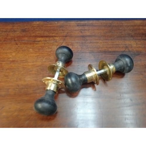 474 - TWO PAIRS OF EBONISED WOOD AND BRASS DOORKNOBS 6cm (d)