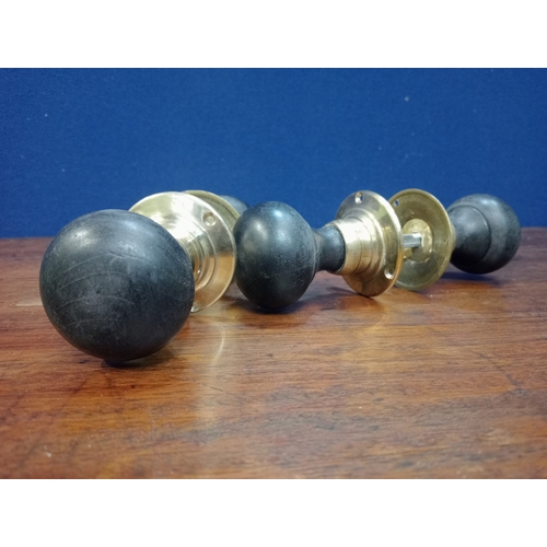 474 - TWO PAIRS OF EBONISED WOOD AND BRASS DOORKNOBS 6cm (d)