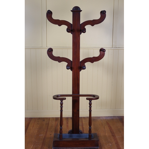 48 - A 19TH CENTURY MAHOGANY COAT TREE with stick compartment and removable zinc drip tray on platform su... 