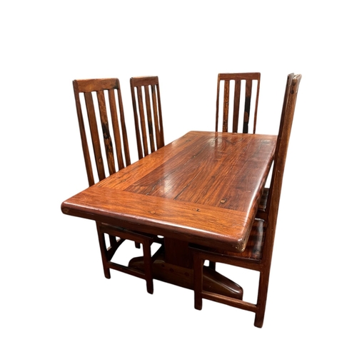 49 - A SEVEN PIECE MEXICAN HARDWOOD DINING ROOM SUITE comprising a set of five high back dining chairs wi... 