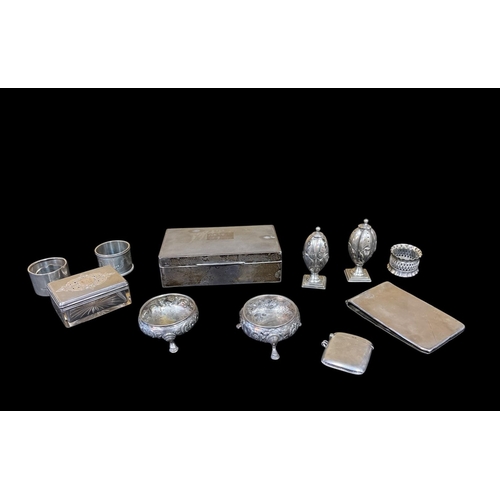 522 - A COLLECTION OF SILVER to include an engine turned cigarette case, a vesta case, an engraved and gla... 