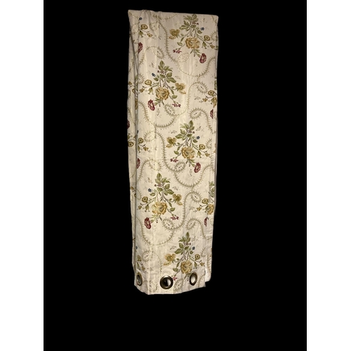 636 - A PAIR OF CREAM FLORAL EMBROIDERED CURTAINS lined with gilt eyelet rings 310cm drop x 140cm (w) toge... 