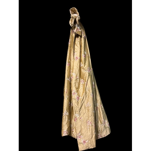 638 - A PAIR OF GOLD SILK CURTAINS printed with stylised flowerheads and foliage lined and interlined 220c... 