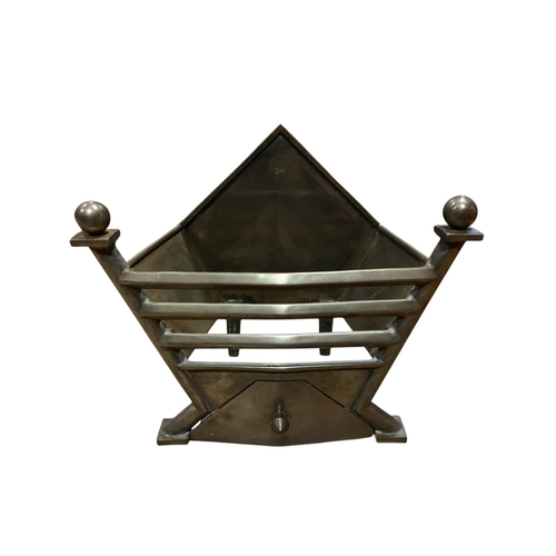 648 - A WHITE METAL DOG GRATE the shaped backplate with pierced apron and spherical finials on splayed leg... 