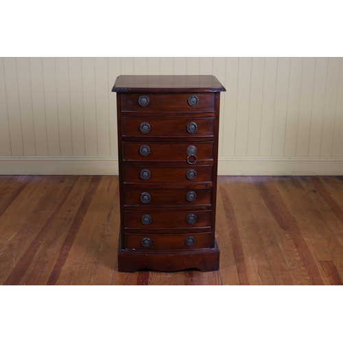 67 - A MAHOGANY CHEST of demi lune outline the shaped top above seven long drawers on shaped platform sup... 