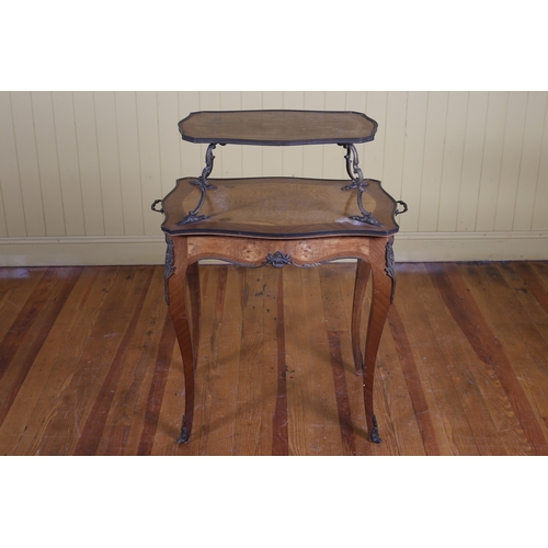 68 - A CONTINENTAL KINGWOOD INLAID AND GILT BRASS MOUNTED TWO TIER TABLE of serpentine outline the shaped... 