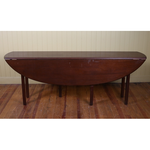 9 - A GEORGIAN STYLE MAHOGANY HUNT TABLE the oval hinged top raised on six square moulded legs 76cm (h) ... 