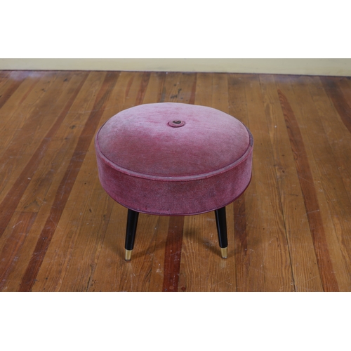 84 - A VINTAGE FOOTSTOOL of cylindrical outline the upholstered seat on ebonised and gilt brass legs 36cm... 