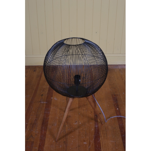 277 - A BEECHWOOD AND WIREWORK TABLE LAMP the spherical shade raised on cylindrical tapering legs 74cm (h)