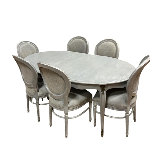 16 - A CONTINENTAL GREY PAINTED AND UPHOLSTERED SEVEN PIECE DINING ROOM SUITE comprising six dining chair... 