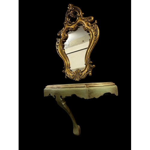 640 - A CONTINENTAL GREEN PAINTED AND PARCEL GILT WALL MOUNTED CONSOLE TABLE of serpentine outline on fron... 