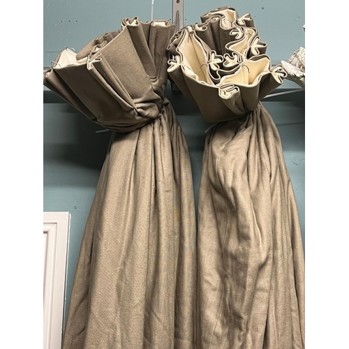 653 - A PAIR OF LIGHT BROWN CURTAINS lined and interlined 220cm drop x 340cm (w)