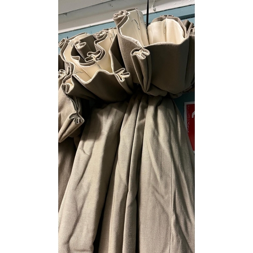 657 - A PAIR OF LIGHT BROWN CURTAINS lined and interlined Each curtain 220cm drop x 340cm (w)