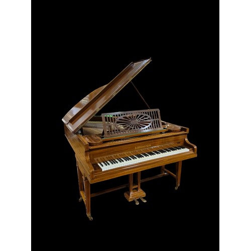 A BECHSTEIN MAHOGANY INLAID CASED BABY GRAND PIANO Serial No. 90703 raised on and dual square tapering legs with spade feet and brass caps and castors 100cm (h) x 141cm (w) x 186cm (d)