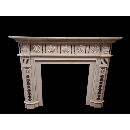 464 - A WHITE MARBLE INLAID CHIMNEY PIECE of inverted breakfront outline the stepped shelf above a paterae... 