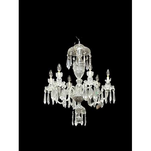 A WATERFORD CUT GLASS SIX BRANCH CHANDELIER  hung with faceted pendants 85cm drop together with A TWO BRANCH WALL SCONCE with scroll arms hung with faceted pendants 24cm (h) x 31cm (w)