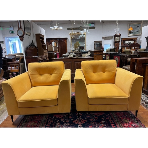A PAIR OF DESIGNER ARMCHAIRS each of rectangular outline with loose cushions on cylindrical tapering legs, Overall 90cm (h) x 103cm (w) x 96cm (d), Seat 41cm (h) x 60cm (w) x 66cm (d)
