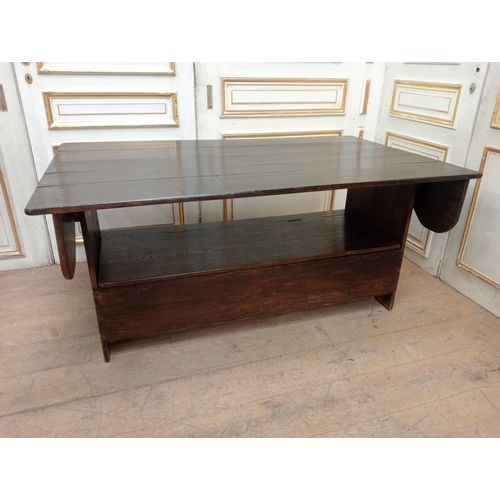 411 - A GEORGIAN STYLE OAK MONK'S BENCH / TABLE of rectangular form on standard end supports 127cm (h) x 1... 