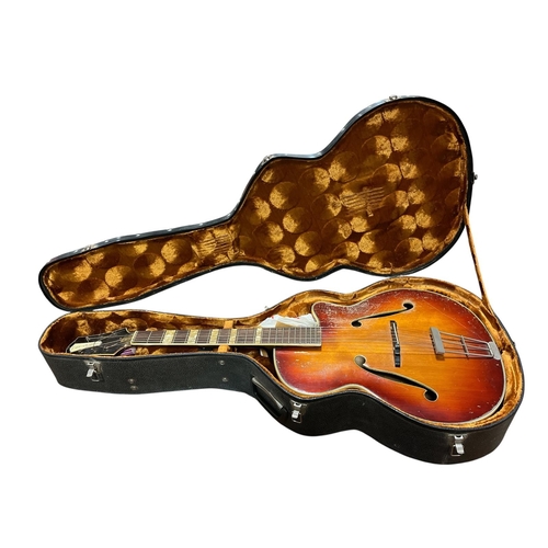 A VINTAGE ARISTONE SIX STRING GUITAR in case