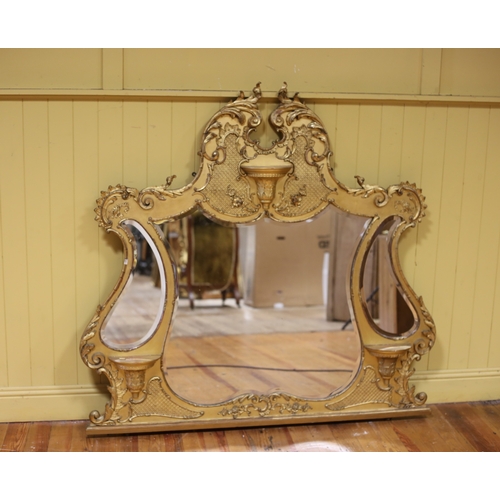 160 - A 19TH CENTURY GILTWOOD AND GESSO COMPARTMENT OVERMANTEL MIRROR the shaped bevelled glass plates wit... 