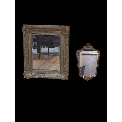 159 - A LATE 19TH CENTURY GILTWOOD AND GESSO MIRROR the rectangular bevelled glass plate within a flowerhe... 