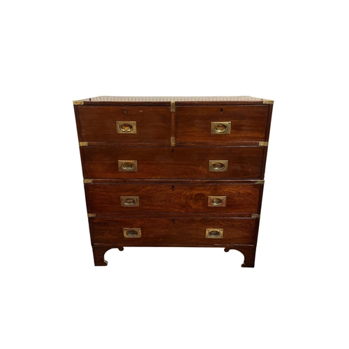 354 - A 19TH CENTURY MAHOGANY MILITARY CHEST ON CHEST of rectangular outline the shaped top above two shor... 