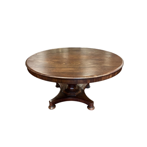 356 - A 19TH CENTURY MAHOGANY POD TABLE the circular moulded top above a faceted column on shaped platform... 