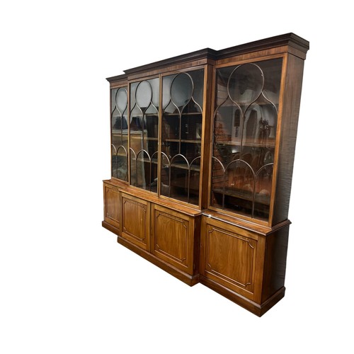 56 - A FINE 19TH CENTURY MAHOGANY AND ROSEWOOD CROSSBANDED BREAKFRONT LIBRARY BOOKCASE the dentil moulded... 