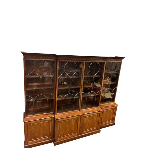 56 - A FINE 19TH CENTURY MAHOGANY AND ROSEWOOD CROSSBANDED BREAKFRONT LIBRARY BOOKCASE the dentil moulded... 