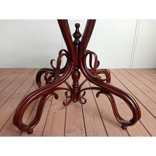 36 - A FRENCH BISTRO BENTWOOD TABLE of oval outline the shaped top with white veined marble top above an ... 