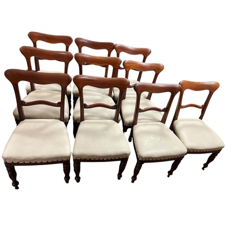 A GOOD SET OF TEN 19TH CENTURY MAHOGANY DINING CHAIRS each with a curved top rail and splat with upholstered seats on reeded baluster legs