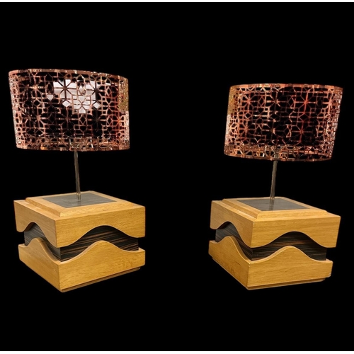 236 - A PAIR OF BEECHWOOD AND SIMULATED ROSEWOOD TABLE LAMPS the square stepped base with wavy frieze and ... 