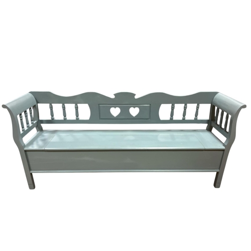 311 - A PINE AND GREY PAINTED BENCH the serpentine top rail with baluster splats and shaped arms and hinge... 