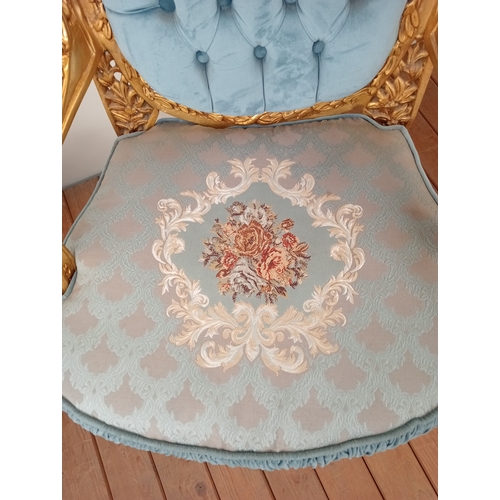41 - A PAIR OF CONTINENTAL CARVED GILTWOOD AND UPHOLSTERED WING CHAIRS each with flowerhead and foliate c... 