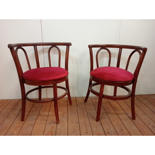 83 - A PAIR OF THONET BENTWOOD TUB SHAPED ELBOW CHAIRS with upholstered seats 76cm (h) x 61cm (w) x 54cm ... 
