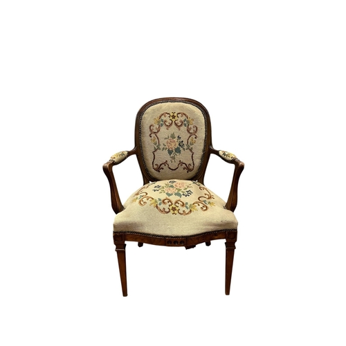 85 - A CONTINENTAL STAINED WOOD AND NEEDLEWORK UPHOLSTERED ARMCHAIR the oval upholstered back and seat wi... 