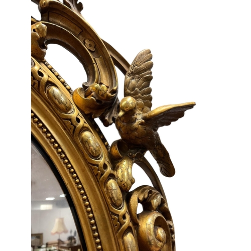 112 - A FINE 19TH CENTURY GILTWOOD AND GESSO MIRROR the rectangular arched plate within an egg and dart an... 