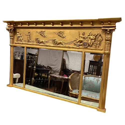 117 - A REGENCY GILTWOOD AND GESSO COMPARTMENT OVERMANTEL MIRROR of inverted breakfront outline the frieze... 