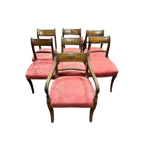 61 - A SET OF SEVEN REGENCY MAHOGANY DINING CHAIRS, including an elbow chair, each with a curved top rail... 