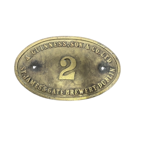 641 - A BRASS ARTHUR GUINNESS & SON LOCOMOTIVE NUMBER PLATE bearing the number 2 31cm (h) x 28cm (w)
